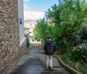 A man walking along streets of Biarritz, France