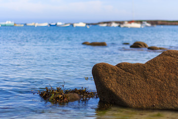 Fototapeta premium rock and seascape with boats