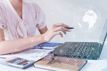 Asian Businessman using computer laptop showing trading graph beside the stock exchange trading graph screen laptop,Profit graph of stock market indicator.Business financial and forex concept