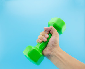 man's hand holding dumbbell. Close up, concept of healthy lifestyle