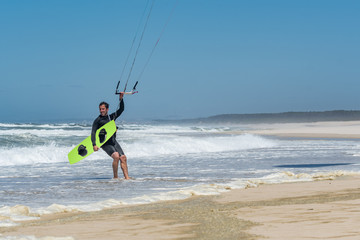 Kiteboarder enjoy surfing on a sunny day.