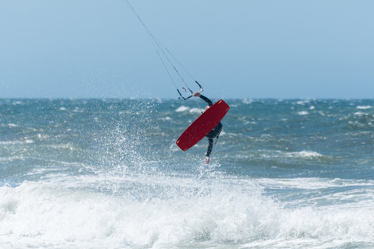 Kiteboarder enjoy surfing on a sunny day.