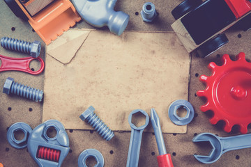 Kids construction toys tools , Colorful toy tools, construction on wooden background. Top view. Flat lay. Copy space for text