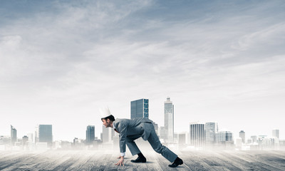 King businessman in elegant suit running and modern cityscape at