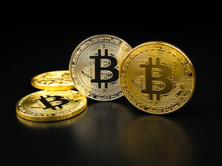 Golden adnd silver bitcoin on black background. Bitcoin cryptocurrency.