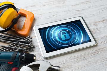 Web security and technology concept with tablet pc on wooden table © adam121