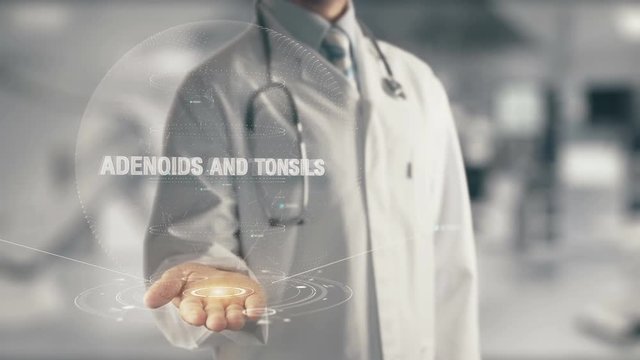 Doctor holding in hand Adenoids and Tonsils