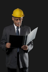 Senior engineer holding a file 