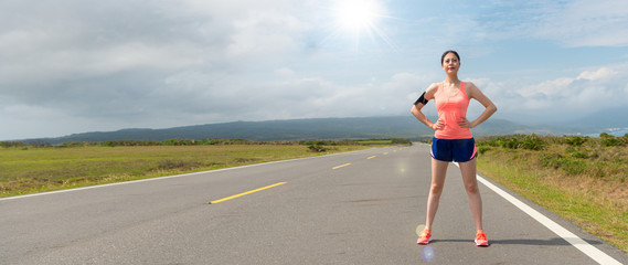 confident asian woman standing on the road