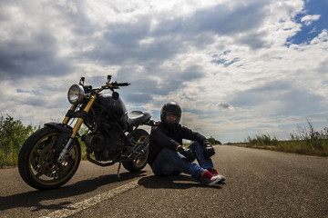 Obraz na płótnie Canvas Sitting With Motorcycle