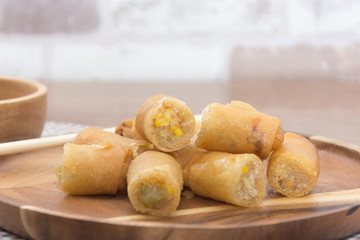 Fried Spring Roll on wooden plate with sauce