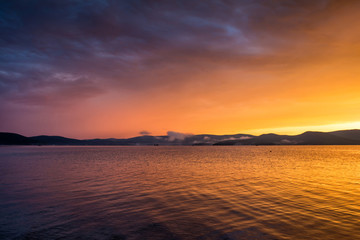 Purple yellow sunset on the lake