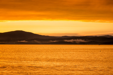 Scenic orange yellow sunset on the lake