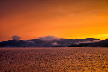 Scenic orange yellow sunset on the lake