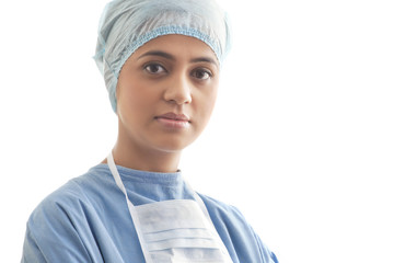 Close-up portrait of a confident female surgeon isolated over white background 