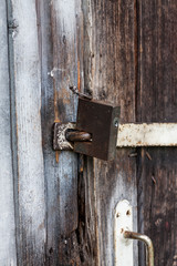 Closeup shot of an old metal lock, selective focus, vertical