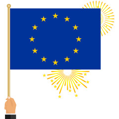 The hand holds the flag of the European Union