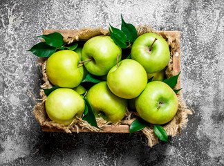 box with fresh, green apples.