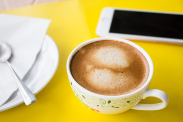 Cup of coffee on background