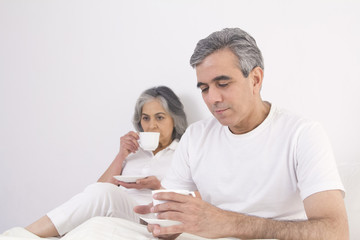 Husband and wife having tea