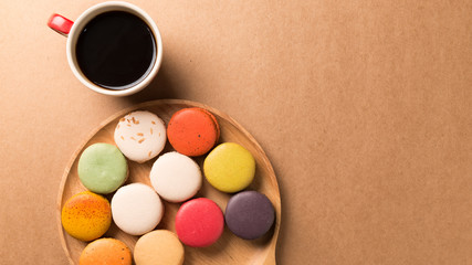 Colorful macaroons. Sweet macarons on retro  background .