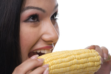 Woman eating corn 