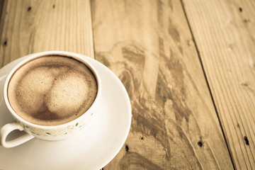 Cup of coffee on background