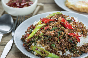 Close-up Hot Rice topped with stir-fried pork and basil food of thailand.
