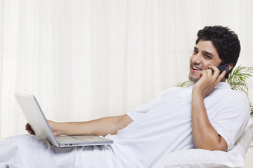 Young man having conversation on mobile phone 