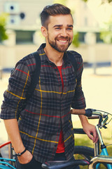 Fototapeta na wymiar A man near bicycle parking.