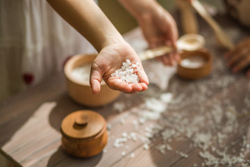 Child helping on the kitchen. Playing with the food. Small hands