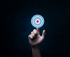 Hand pressing on target goal.