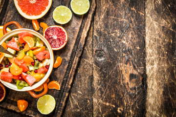 Summer food . Fruit salad in a bowl.