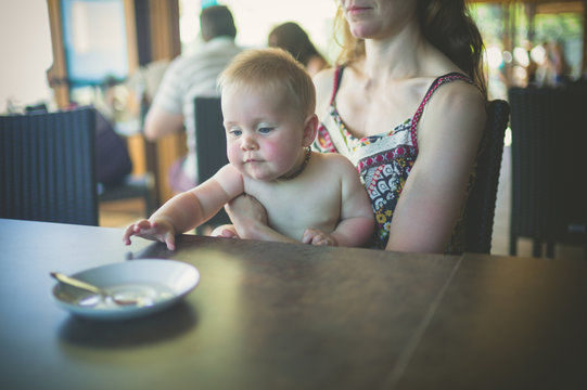 Mother with baby in a cafe