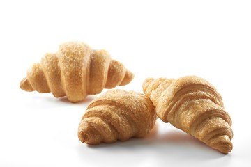 Small croissants isolated on white delicious tasty pastry freshly baked homemade breakfast concept. 