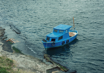 Fototapeta na wymiar Small Boat on the Shore