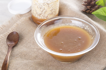 Fresh honey in a glass bowl and a spoon. And produced in Ontario Canada. Canadian honey.