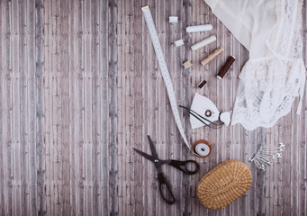 Background with sewing tools and accessories.