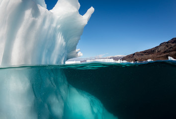 Underwater view of icebergs in Scores Bysund Fjord, east Greenland. - obrazy, fototapety, plakaty