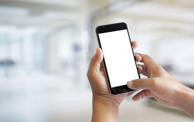 Man's hand using cellphone outdoor, Man typing text message on smart phone, Blurred background