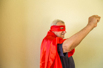 old super hero raising fist