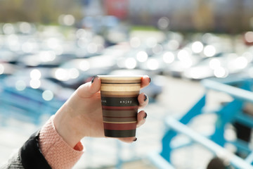 A cup of coffee in hand