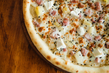 delicious pizza with meat, cheese and mushrooms