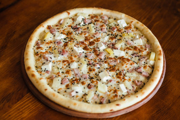 delicious pizza with meat, cheese and mushrooms