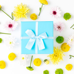 Blue gift boxes with different chrysanthemums on a white background