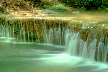 Amazing beautiful deep forest waterfall in Erawan National Park, Kanchanaburi, Thailand