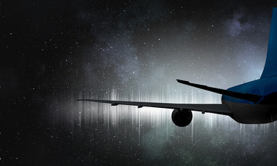 Obraz premium Silhouette of airplane in sky. Mixed media
