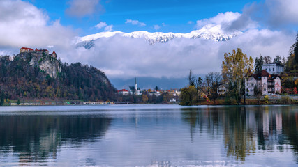 Fototapeta na wymiar Bled lake with castle, Bled city and mountains on the background