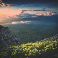 A view of mountain valley with colorful clouds. Instagram stylization