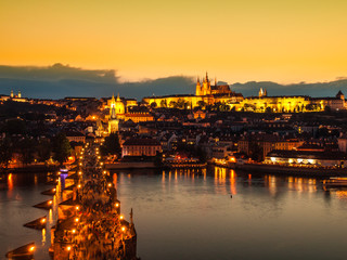 Prague evening panorama. Aerial view of Prague Castle and Charles Bridge over Vltava river from Old Town Bridge Tower, Czech Republic.